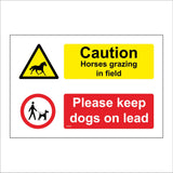 MU402 Caution Horses Grazing In Field Dogs On Lead