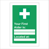 FS164 Your First Aider Is: Located At: Sign with Cross