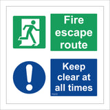 FS233 Fire Escape Route Keep Clear At All Times Sign with Door Man Circle Exclamation Mark