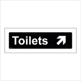 GG391 Toilets Up Right Arrow White On Black Plaque