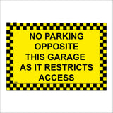 TR868 No Parking Opposite This Garage Restricts Access