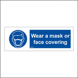 MA678 Wear A Mask Or Face Covering Sign with Mask Face