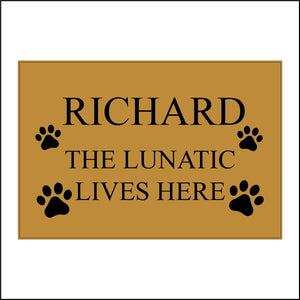 CM140 Personalise The Lunatic Lives Here Sign with Paw Prints