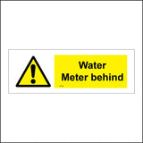 WT058 Water Meter Behind Sign with Triangle Exclamation Mark