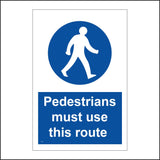 MA473 Pedestrians Must Use This Route Sign with Man Walking In Circle